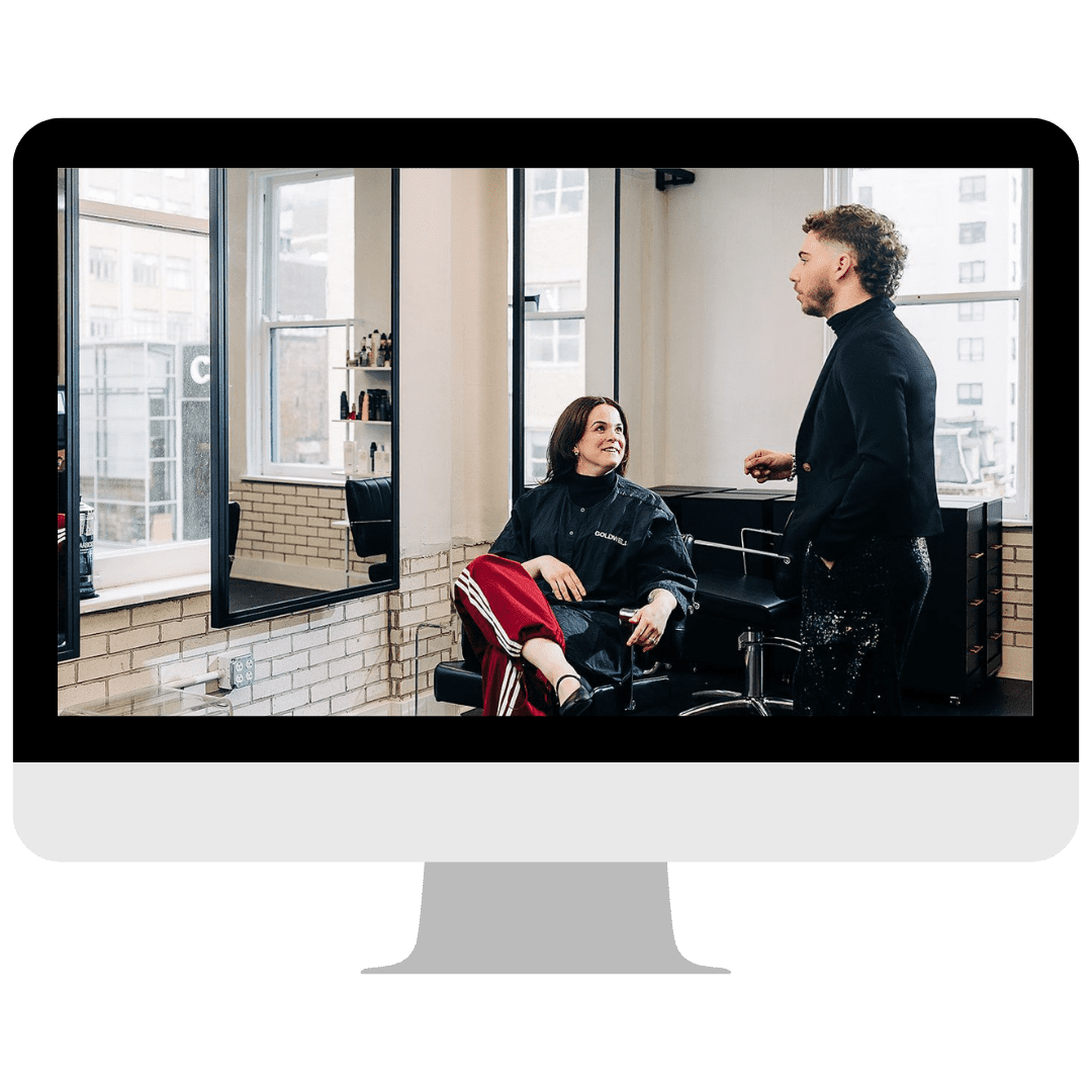 Hunter Donia talking with a client in the chair - In The Chair phase