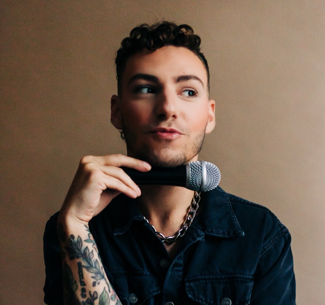 Hunter Donia speaking headshot, with microphone