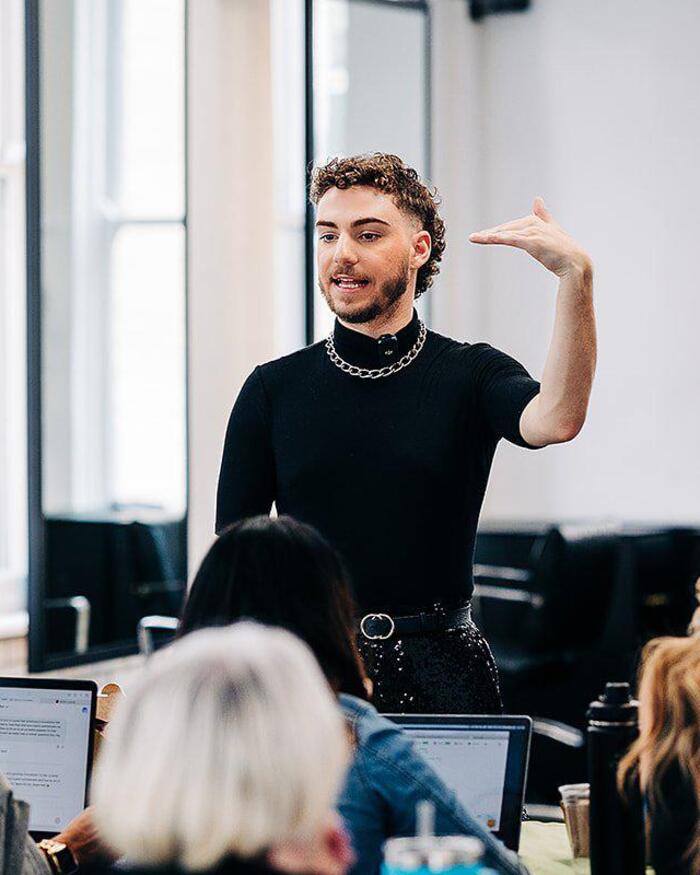 Hunter Donia teaching a room of stylists